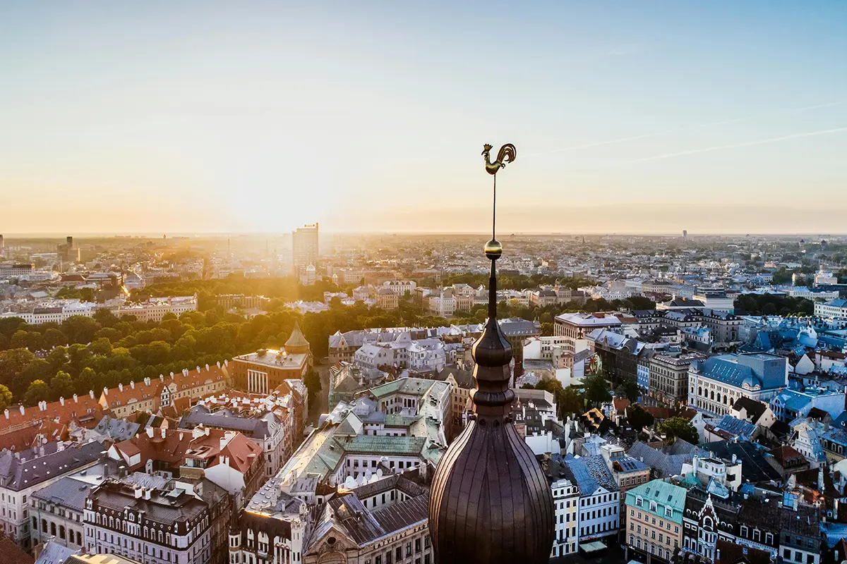  Historic city skyline at sunrise from rooftop view.