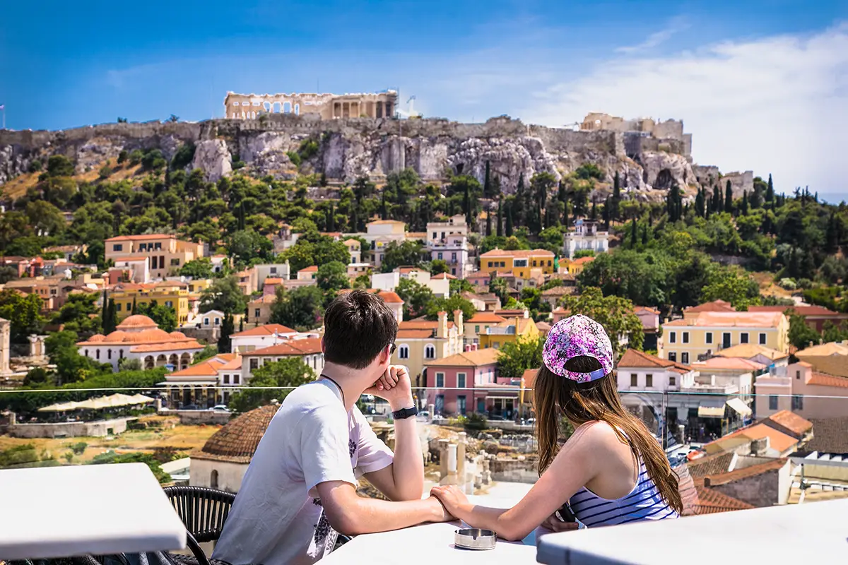 Couple looking at Monastiraki in Athens, Greece.