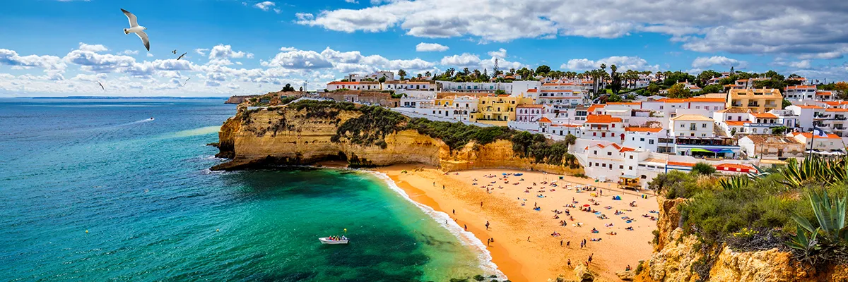 Portugal vs. Spain vs. Greece: Where to Buy Property?  Landscape of a sea town in Portugal, Carvoeiro.