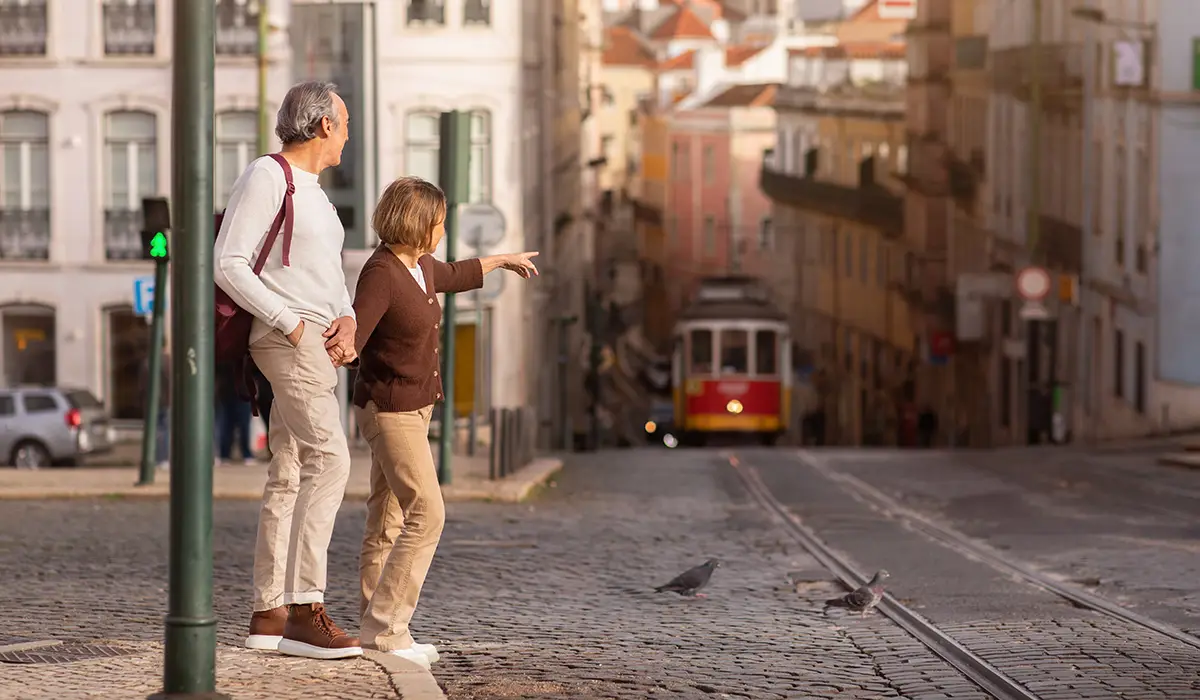 https://www.investmentvisa.com/images/portugal-lisbon-senior-couple-walking.webp?utm_source=chatgpt.com